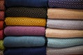 Stacked multicolored clothing fabric in the closet bed linen banner. Royalty Free Stock Photo