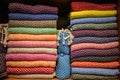 Stacked multicolored clothing fabric in the closet bed linen banner. Royalty Free Stock Photo