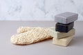 Stacked natural soap, and natural bast sponge for bath. Zero waste background, plastic free bathroom and home. Trendy minimalism, Royalty Free Stock Photo