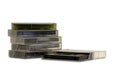 Stacked old audio tapes, isolated on white background. Popular audio recording medium from 1970s, 1980s and 1990s. Royalty Free Stock Photo