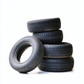 Stacked old tires in pyramid formation on transparent background. Black tires arranged in precise triangular pattern. Largest