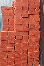 Stacked orange bricks at a construction site Royalty Free Stock Photo