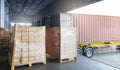 Stacked of Package Boxes Load with Cargo Container. Trailer Truck Parked Loading at Dock Warehouse. Delivery Service. Royalty Free Stock Photo