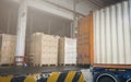 Stacked of Package Boxes on Pallet with Cargo Container. Trailer Parked Loading at Dock Warehouse. Delivery Service. Royalty Free Stock Photo