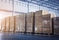 Stacked of Package Boxes Wrapped Plastic Flim on pallets at Storage Warehouse. Shipping Warehouse Logistics.