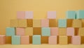 Stacked pastel and gold cubes forming a wall-like structure Royalty Free Stock Photo