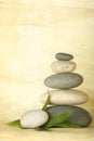 Stacked pebbles & bamboo leaf