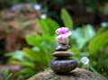 Stacked pebbles in the garden. Zen, spa or wellness concept