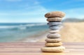 Stacked pebbles to make shape of hourglass as a symbol of time management.