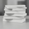 A stacked pile of blank white hardcover books is displayed on a smooth surface. The Royalty Free Stock Photo