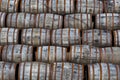 Stacked pile of old wooden barrels and casks at whisky distiller Royalty Free Stock Photo