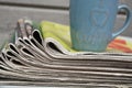 Stacked and piled up newspapers on a wooden table background Royalty Free Stock Photo