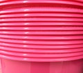 Stacked Pink Round Plastic Trays