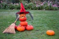 stacked pumpkin pyramid stuffed with halloween spooky ghost in hat and mask Royalty Free Stock Photo