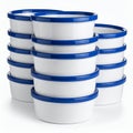 Stacked ramekins in crisp white with striking blue rims create visual harmony on white background Royalty Free Stock Photo
