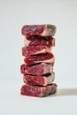 Stacked Raw Steaks: Premium Red Meat Tower on White Royalty Free Stock Photo