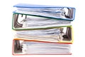 Stacked red, green, blue and yellow office folders