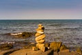 Stacked rock over seacoast skyline Royalty Free Stock Photo