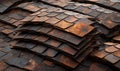 Stacked rusty scale-shaped metal sheets for industrial roofing or cladding Royalty Free Stock Photo