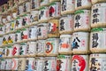 Stacked sake barrels on entrance to meiji jingu