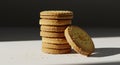 Stacked sandwich cookies with sugar crystals and a single cookie leaning against the stack Royalty Free Stock Photo
