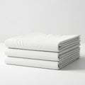 Stacked set of crisp white bed sheets Royalty Free Stock Photo
