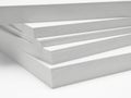 Stacked sheets of pristine white paper on a clean surface Royalty Free Stock Photo