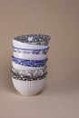 Stack of white kitchen soup bowls with blue and black geometric designs Royalty Free Stock Photo