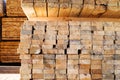 Stacked stacks of wooden planks. Lumber warehouse, wood drying
