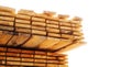Stacked stacks of wooden planks on white background. Lumber warehouse, wood drying.