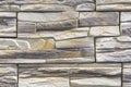 Stacked stone wall, natural stone cladding. Stone wall for background,Slab stone wall texture. Wall background of volcanic Royalty Free Stock Photo