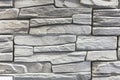 Stacked stone wall, natural stone cladding. Stone wall for background,Slab stone wall texture. Wall background of volcanic Royalty Free Stock Photo