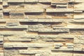 Stacked stone wall, natural stone cladding. Stone wall for background,Slab stone wall texture. Wall background of volcanic Royalty Free Stock Photo