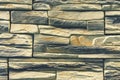 Stacked stone wall, natural stone cladding. Stone wall for background,Slab stone wall texture. Wall background of volcanic Royalty Free Stock Photo