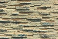 Stacked stone wall, natural stone cladding. Stone wall for background,Slab stone wall texture. Wall background of volcanic Royalty Free Stock Photo