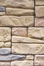 Stacked stone wall, natural stone cladding. Stone wall for background,Slab stone wall texture. Wall background of volcanic Royalty Free Stock Photo