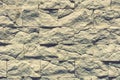 Stacked stone wall, natural stone cladding. Stone wall for background. Wall background of volcanic andesite basalt stone texture.