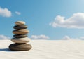 Stacked stones against a blue sky with clouds Royalty Free Stock Photo