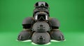 Stacked Tactical Helmets with Goggles on Green Background, Military Gear Concept Royalty Free Stock Photo