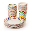 Stacked themed paper party plates and cups Royalty Free Stock Photo