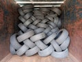 Stacked tires. Pile of old wheels piled up in container. Recycling and environment. Workshops and vehicle spare parts