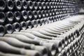 Stacked up dusty champagne bottles in the cellar Royalty Free Stock Photo