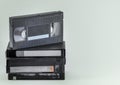 Stacked VHS tapes, isolated. Old VHS video cassettes with copy space. Outdated technology. Highly popular old video technology fro