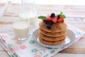 Stacked Waffle with Maple Syrup and Berries Topping Royalty Free Stock Photo