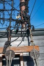 Stacked and well-folded ropes on the deck of a sailing ship. Accessories needed for sailing Royalty Free Stock Photo