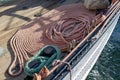 Stacked and well-folded ropes on the deck of a sailing ship. Accessories needed for sailing Royalty Free Stock Photo