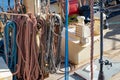 Stacked and well-folded ropes on the deck of a sailing ship. Accessories needed for sailing Royalty Free Stock Photo