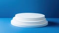 Stacked white round platforms over blue background empty space for product display and design Royalty Free Stock Photo