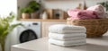 The stacked white towels on a countertop in a modern laundry room. AI generated image Royalty Free Stock Photo