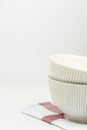 Stacked White Vintage Bowl on Cotton Towel on Wood Table. Holiday Baking Cooking Concept. Christmas Easter. Scandinavian Kitchen